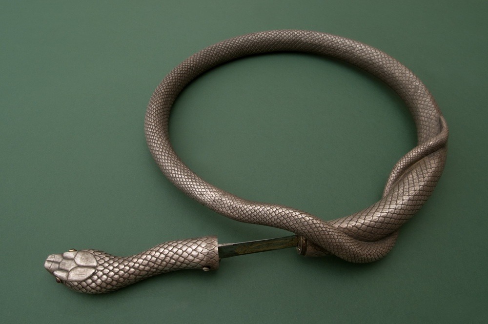 archaeologyart's tweet image. Silver steel flexible double bladed snake rapier,19th century. Place of origin: Toledo, Spain.