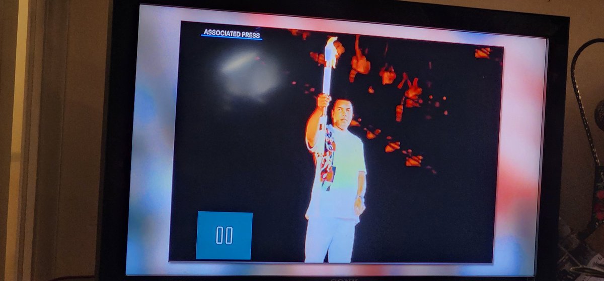 Uuebmeister's tweet photo. Hey @Elex_Michaelson or @BillMelugin_...do you
know anybody at @FOXLA that can update this AP shot of @MuhammadAli  lighting the torch at Alanta in 1996 in its piece on the 1984 games?  He carried  a torch then in Louisville, but Rafer Johnson lit the Coliseum torch on 1984. https://t.co/NKLfdlOQ0P