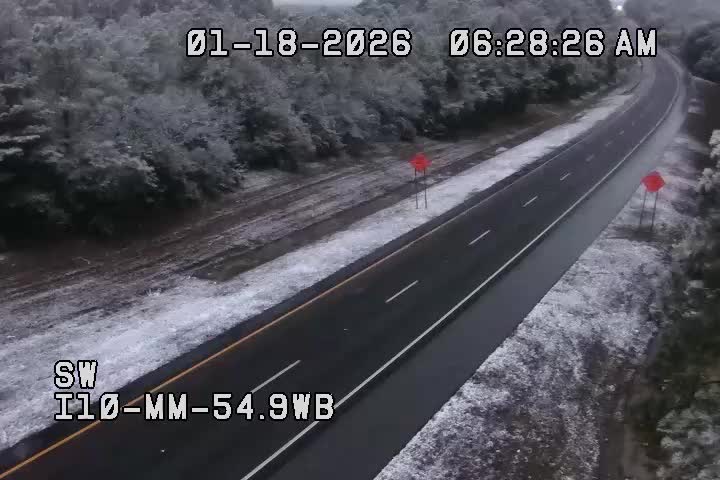 BenNollWeather's tweet image. Sunrise reveals a snow-covered landscape in the Florida Panhandle along Interstate 10.