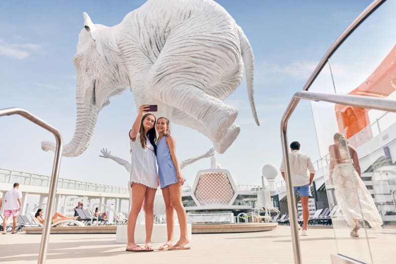 🌟🌊 Capture the fun at the Resort Deck aboard the Celebrity Beyond! It's the perfect spot for people to relax, take selfies, and enjoy the summer vibes. 

Contact me today to book your cruise on the Celebrity Beyond and make unforgettable memories! 📞🛳️