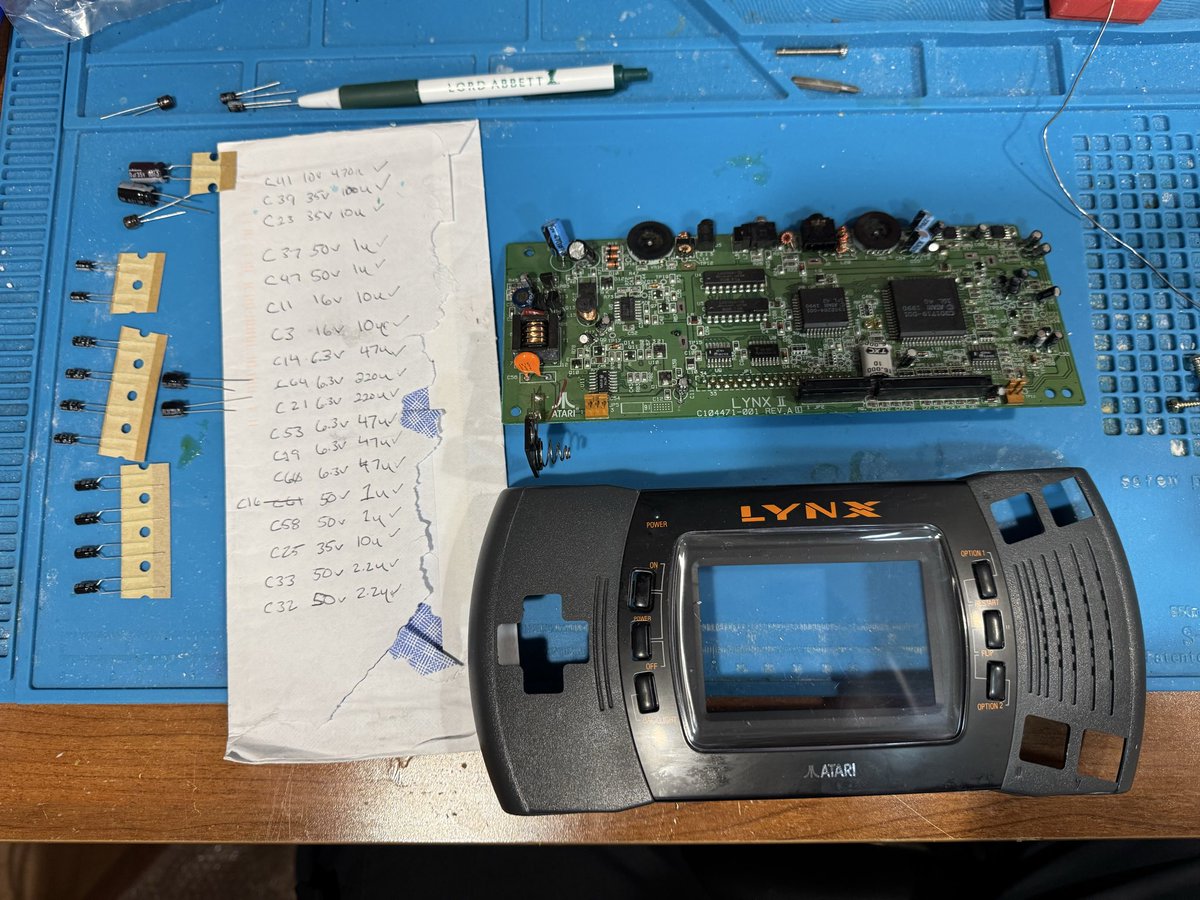 printmeister's tweet photo. Getting ready to do some work on a broken Atari Lynx II that I bought a couple years ago. Needed some capacitors replaced, might as well do them all while it’s opened. https://t.co/GipCLnAQTc
