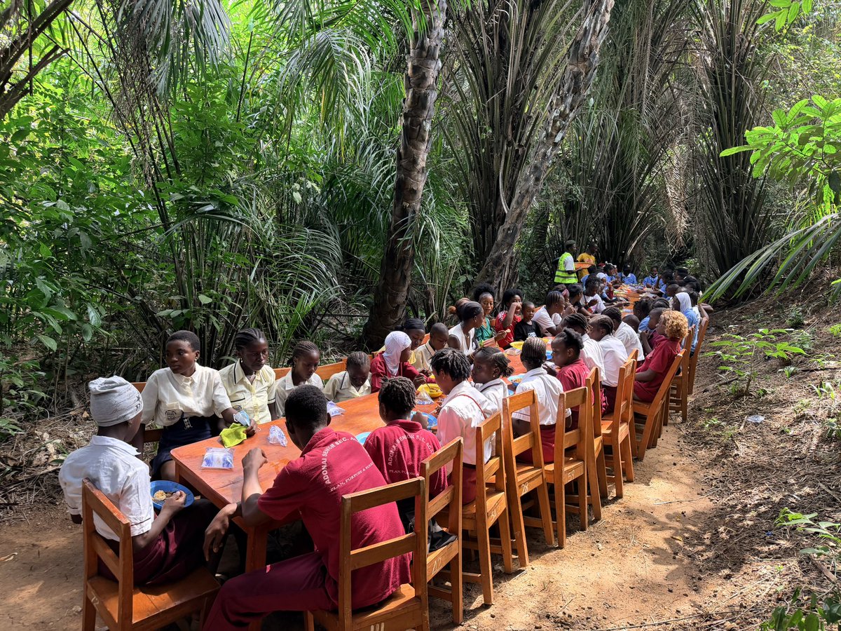 CenterMemory's tweet photo. After their community service of cleaning Robis Village on this first official National Remembrance Day students gathered in the Palmwine Corner for a meal. We are grateful to @ATJLF_ for supporting our efforts over the years towards a Remembrance Day in Sierra Leone. https://t.co/R9W0B6KZqF