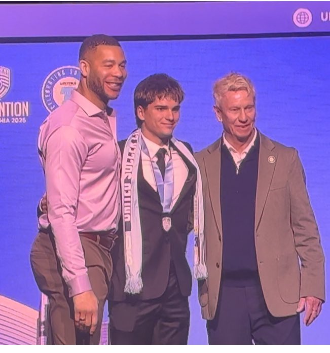 Hayden Xhokaxhiu gets his all American picture with Former USA national team player Oguchi Onweyu and United Soccer Coaches President Paul Payne