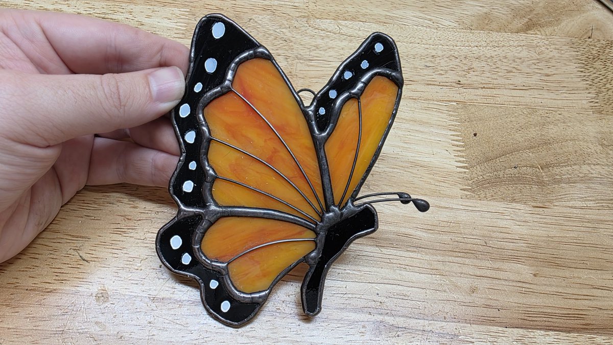 PrismtreeStudio's tweet photo. It's gray and raining in Florida today,  but sunny days will be back soon. 

#butterfly #stainedglass #suncatcher #etsy #glass https://t.co/VuZdSXcfNw