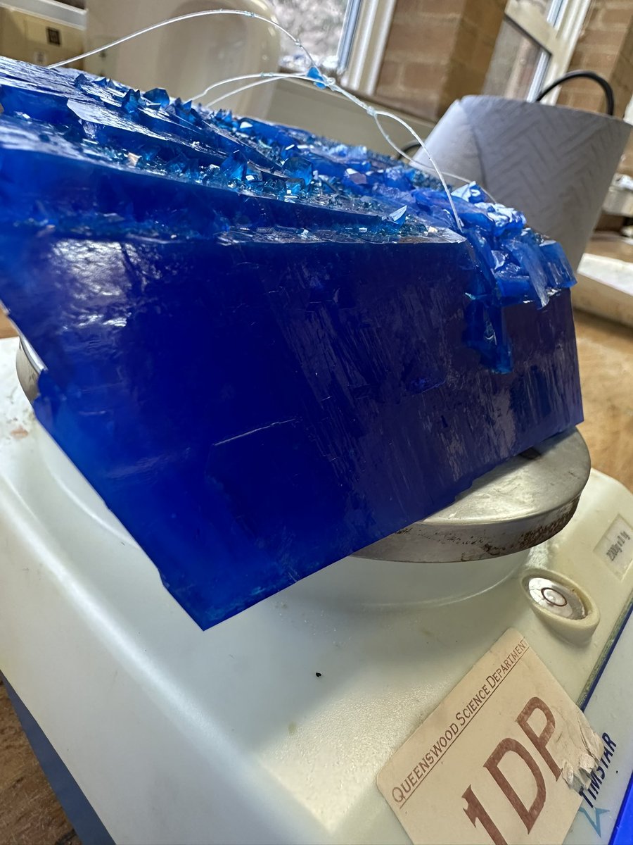 DrDavidBoyce's tweet photo. Big blue - my giant copper sulfate crystal today hit 7000 carats - or 1400g. It now is about a year old. https://t.co/batlUEu0oP