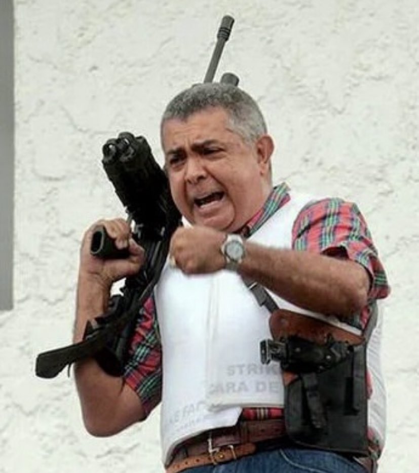 CARIBBEUS's tweet photo. This is Venezuelan General Ángel Vivas, and Delta Force agents would definitely pay respects to him today. Long critic of Chávez and Maduro’s race Communism, he faced the regime’s Military Counterintel in a standoff at his house, during the 2014 protests.

Refusing to turn himself in, he faced the agents from his balcony, with his machine gun and his big cojones. For 1,100 days the Communist intel laid siege to his house, until he was lured out of it in 2017. He then suffered an ambush, where he was kidnapped by the regime forces. 

A year later, he was released from El Helicoide, Venezuelan intel’s prison known for holding political prisoners who suffer the most terrible tortures. As a reporter of the regime’s official channel announced the news, you could see the General, walking, hunched over as he had suffered a fracture in his spine. Yet, he shouted on national TV: “Death to Tyranny, Long Live Freedom!”

Since then, he’s been in house arrest, where he remains a critic of the regime. Absolute chad.