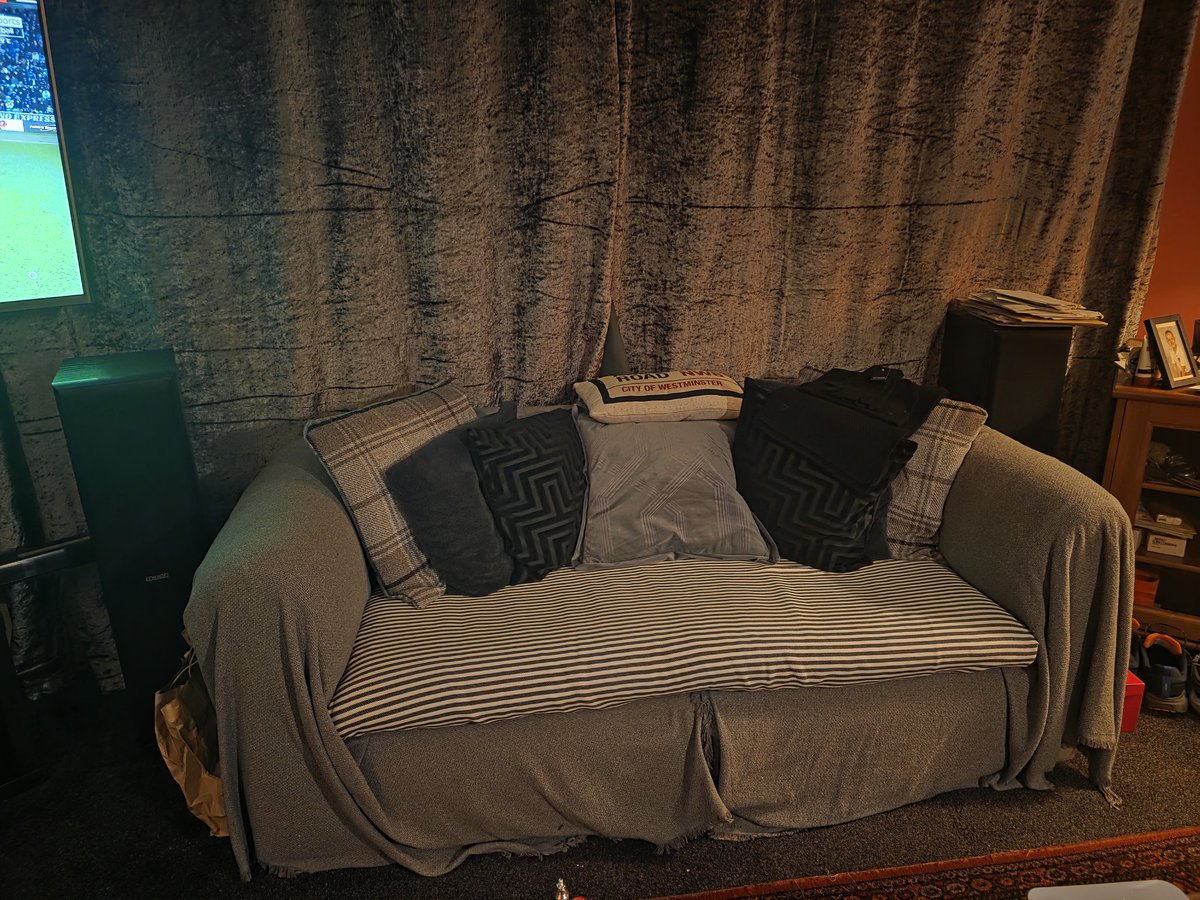 Johnnymagic11's tweet photo. @grok can you put George Harrison relaxing on the couch https://t.co/dxIBo9AhF8