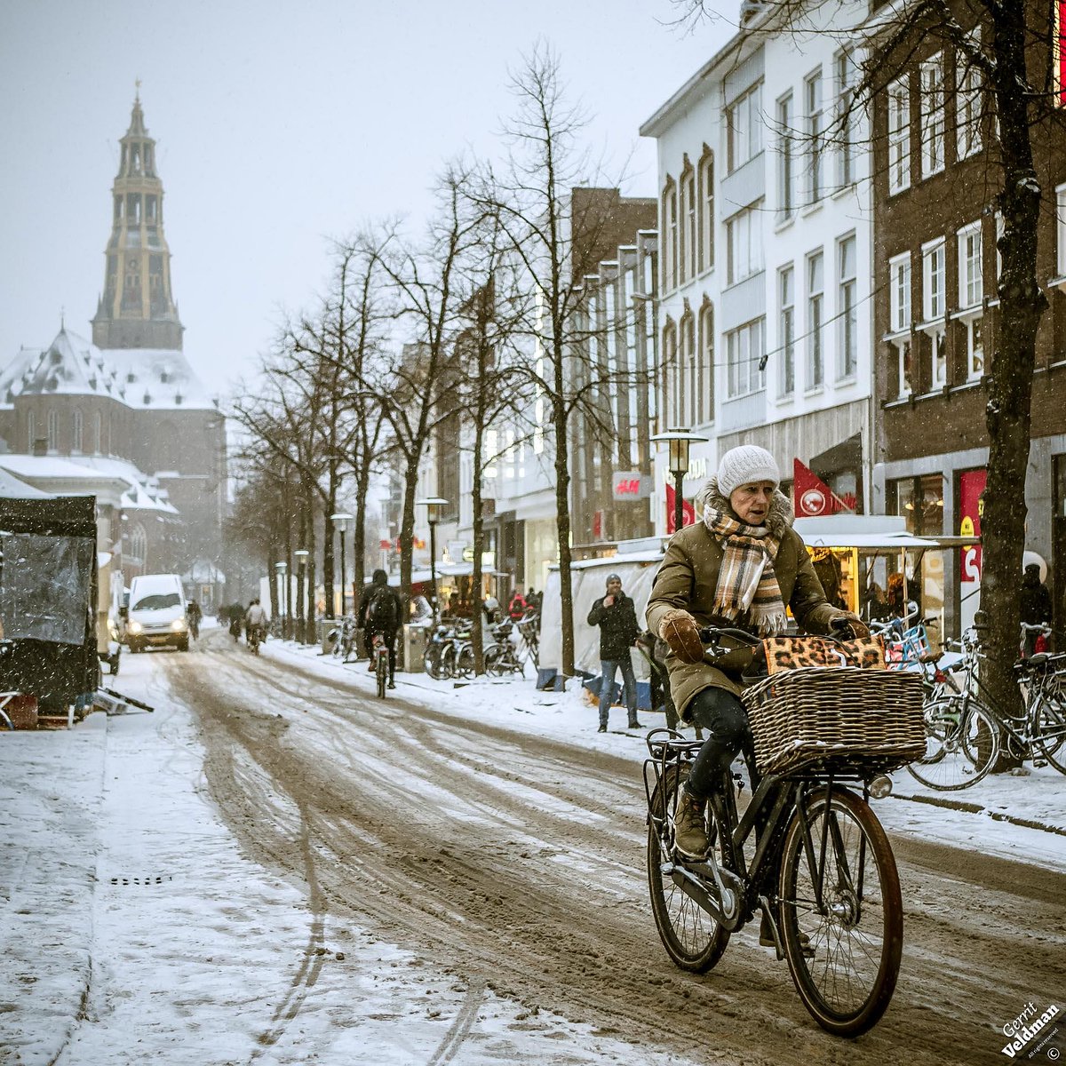Snowdump in Europe and the Netherlands. Busses and trains no longer ride. So, those brave Dutch take their bicycles out and ride through the snow to work, to school, to do groceries. Hey, it may be a bit chilly, but actually it is fun.