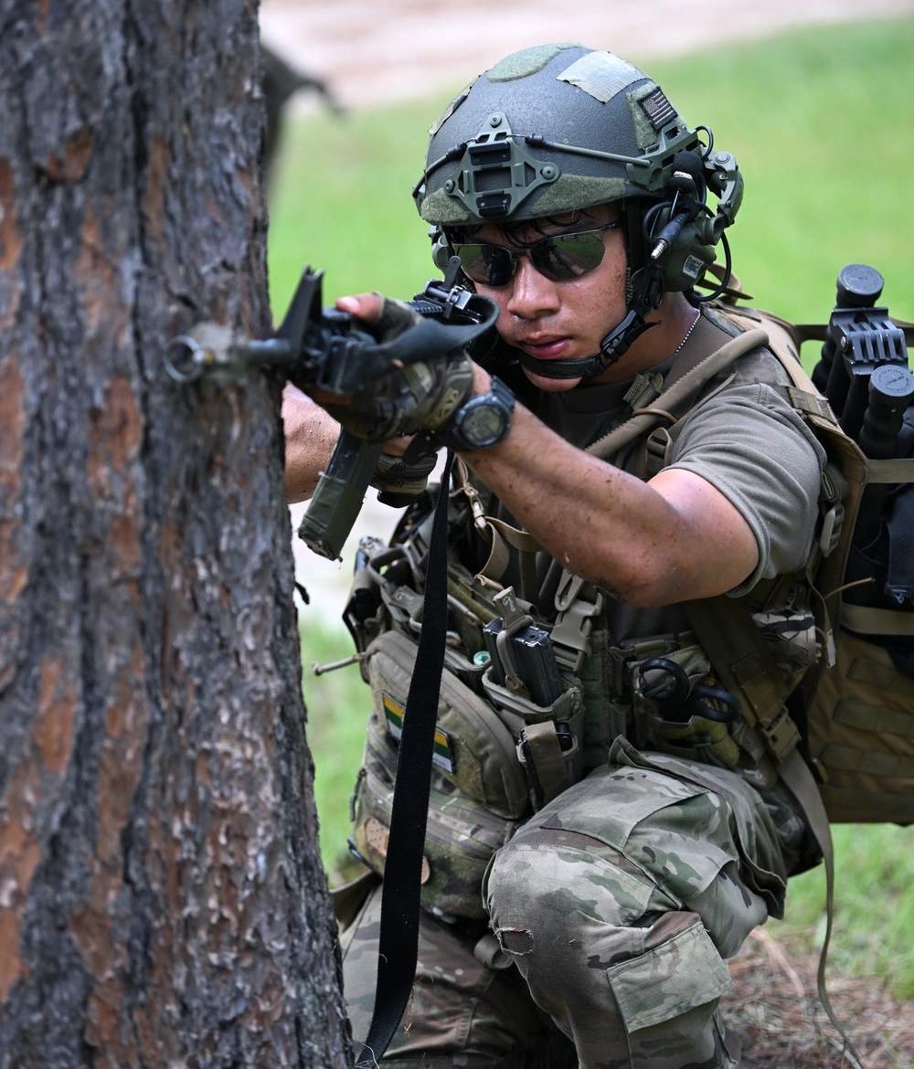 GoArmySOF's tweet image. A Soldier  in the Civil Affairs Qualification Course, fires an M4 carbine at enemy role-players from the fictitious country of "Pineland," during Operation Sluss-Tiller, the culmination exercise for Civil Affairs students, at Camp Mackall, North Carolina.