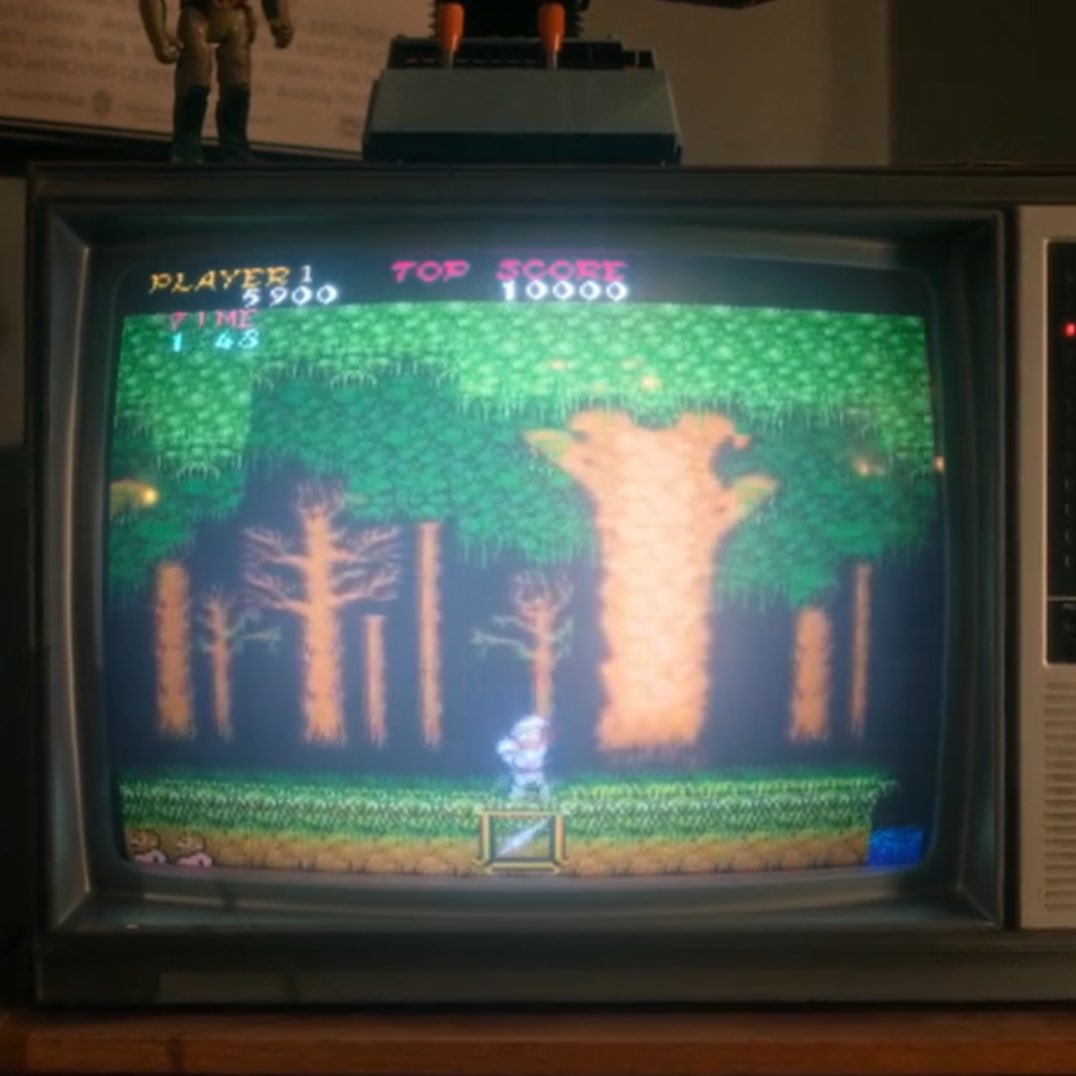 emagoner's tweet image. #conformitygate i was rewatching v1 and noticed that derek is playing “ghosts’n goblins” a game famous for its fake ending where you have to replay the whole thing on harder difficulty to get the true finale. and derek doesn’t get to finish it because tina won’t let him