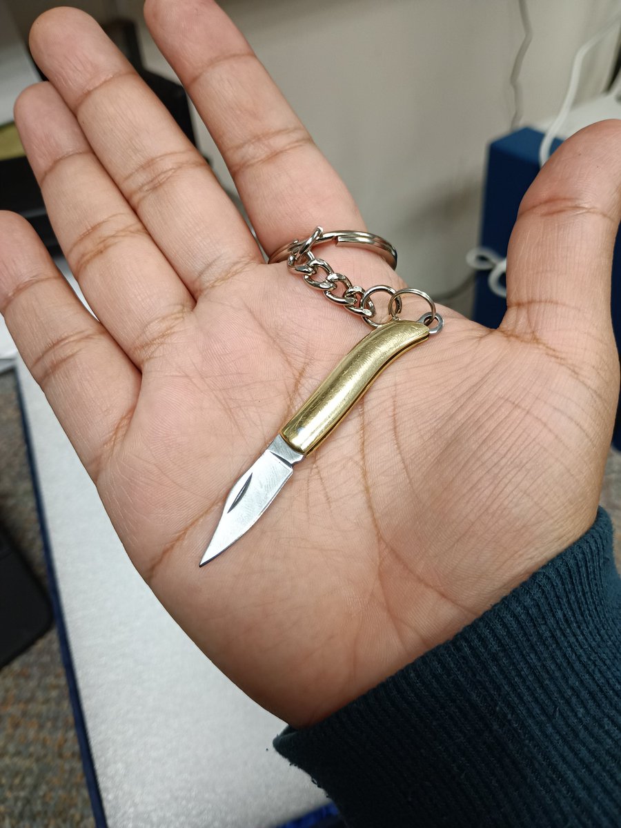 My coworker randomly gave me a mini knife. I love miniature items so much. It's so cute and sharp and stabby. :3<