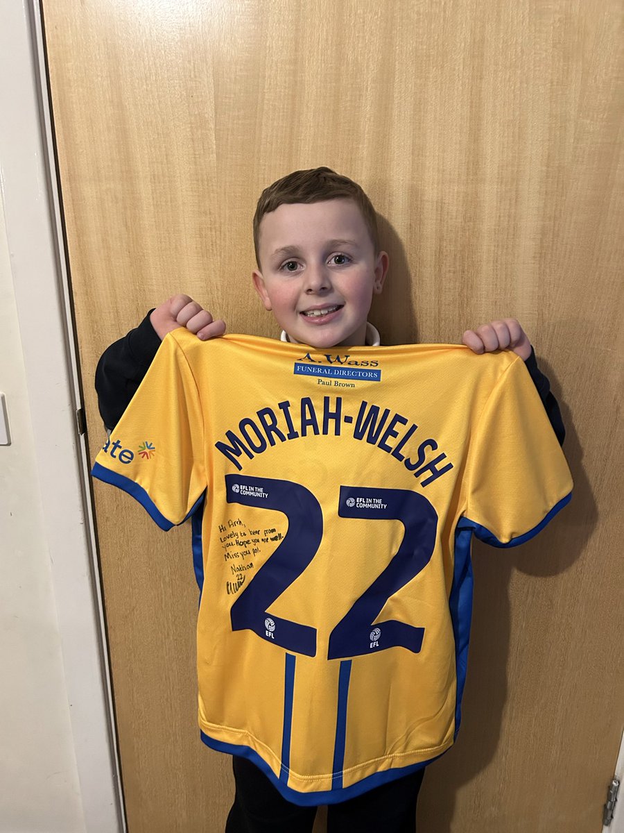 LewisMckinnon2's tweet photo. Archie got a surprise last night and is absolutely over the moon with Mansfield fc home kit and a special message from his favourite player Nathan moriah-Welsh. He is jumping around with excitement after telling him we are going  to watch a game @mansfieldtownfc @HibernianFC https://t.co/47oJ0okUlo