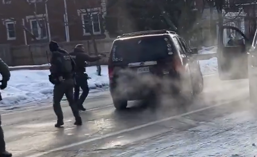 Fritschner's tweet image. The moment when the agent fires his weapon for the third time.

The vehicle is past him and is obviously not a threat to any agent on the scene.