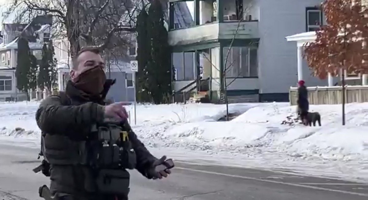 dewforpolitics's tweet image. This is the masked ICE agent who shot the driver in Minneapolis. He fired from the side into the vehicle. This image shows him walking away from the crashed vehicle. Lock him up!