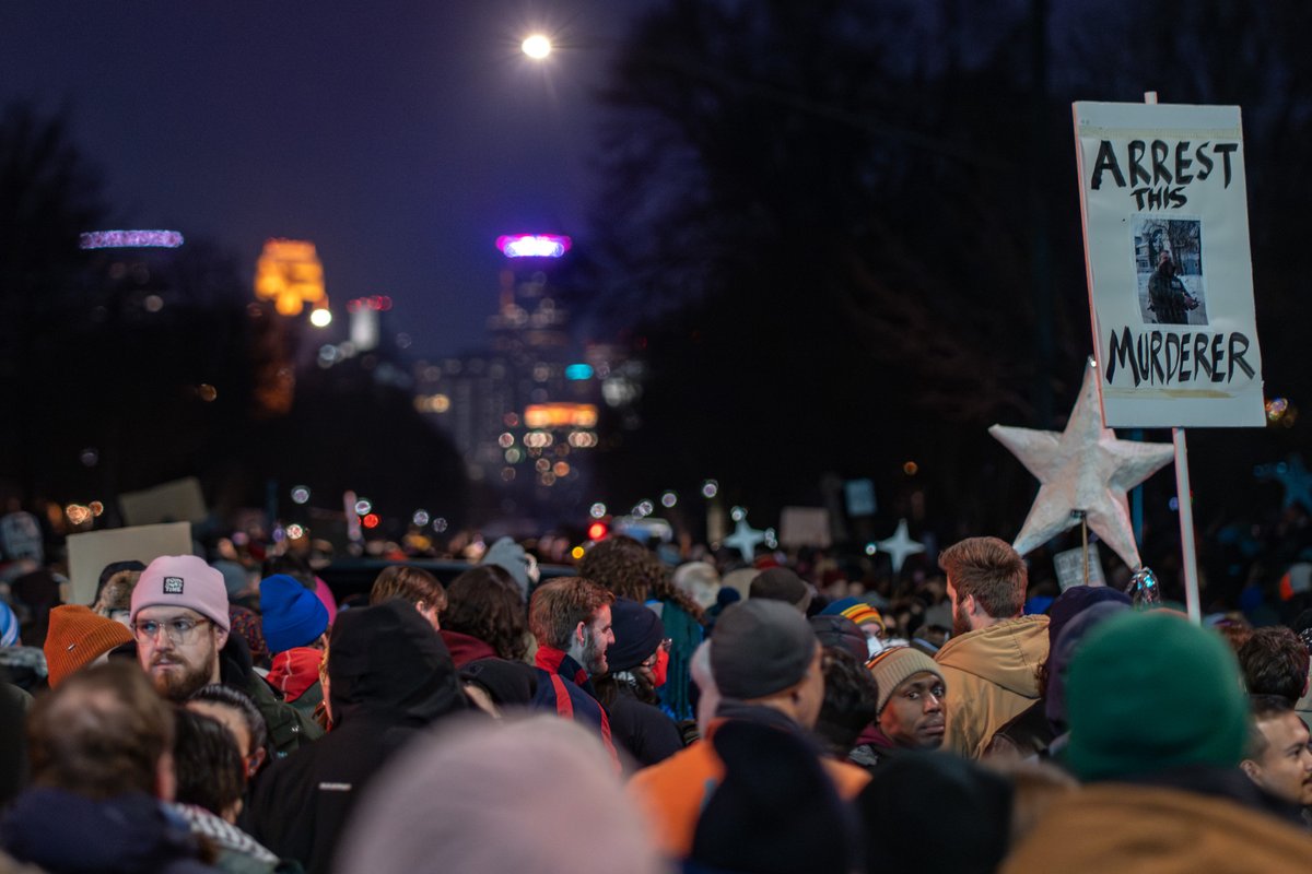 daviss's tweet image. Thousands protest in Minneapolis after 37-year old Renee Good was killed by an ICE agent earlier in the day. Many holding up screen captured images from the viral video that showed the federal agent who shot and killed Good.