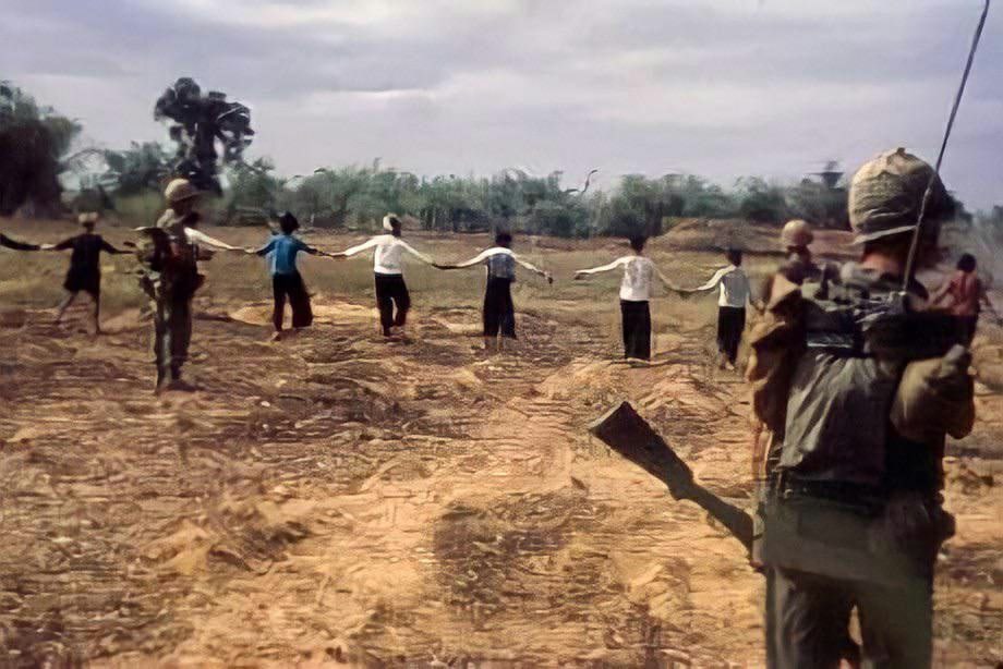 Vietnamese soldiers booby-trapped a field, but the U.S. Marines had a whole village of civilians on hand and forced to march into the field. Vietnam, 1966.