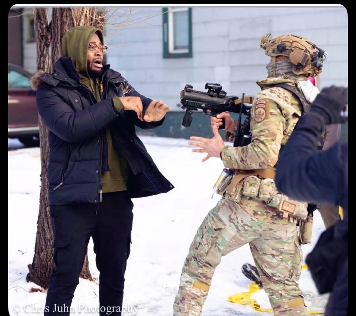 Emeliarjl's tweet image. Another horrifying image out of Minneapolis‼️Look at the terror on this man’s face as a federal agent points a gun at his face &amp;amp; threatens his life‼️