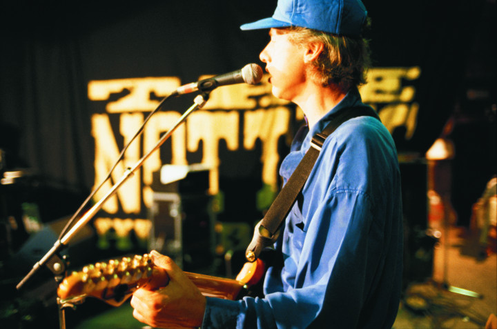 Mark photographed at soundcheck with the Notting Hillbillies in 1990.