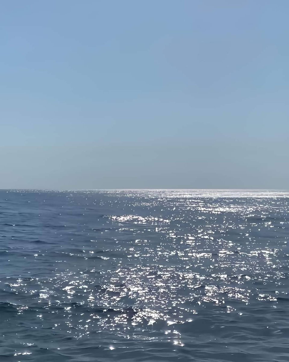 when the sun makes the water glitter.