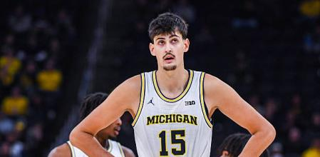 draymottishaw's tweet photo. I have a really hard time seeing Aday Mara being anything less than an impactful rotational big man in the NBA, and he is currently inside my personal top 10 at the moment & I'll very likely have a lottery grade on him no matter what.

Mara, standing at a listed 7'3 and a reported 7'7 wingspan, has been showing signs of increased defensive mobility & cognition which has made his projective defensive utility & impact become more apparent. Mara has a block% of 12.2%, a stl% of 1.2%, and leads the NCAA in DBPM at 8.0 — he is a presence on the basketball court and is a contributing factor as to why Michigan has the best defense in the league. Usually, bigs at that size struggle nabbing steals, which is a statistical indicator of mobility, but Aday has been grabbing them at the rate you would love to see.

Aday Mara brings more than just his defensive impact, he brings an offensive skillset which can be utilized *periodically* throughout games. One of the sell points for Mara is his passing. He thrives at hitting cutters & hitting his partnering forwards down low either from the middle of the floor or out of a roll. Mara is going to naturally bring a significant amount of gravity towards the rim as someone who is 7'3, so the passing becomes valuable once the opposing defense instinctively loads up the back line.

Mara has a turnover problem, but most of his turnovers come from him being in the post/low block. Ideally, with his limited creation and underwhelming shooting touch from >5ft, Mara shouldn't be used that way once he hits the league.

At the end of the day, with his efficiency at the rim (nearly 80%), his passing volume (18% AST%) & defensive numbers, and with his size, I think Mara is a safe bet for any NBA team looking for a rotational big man.