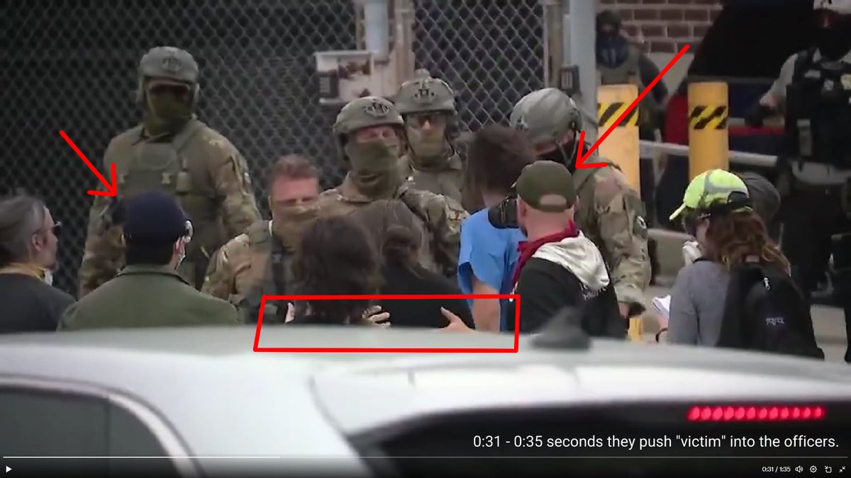 tmeadows813's tweet photo. @DesireeAmerica4 Watch as two males guide then push the "chosen victim" into the officers. Then "red scarf" male starts snapping pictures of what he created. https://t.co/PF2zsch6sl