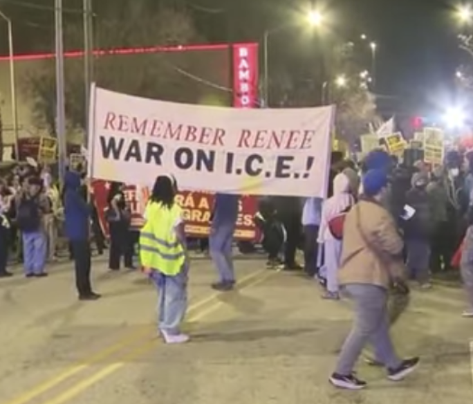 "Remember Renee/War on ICE" banner at Atlanta march
