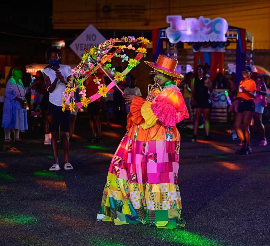 jelinthemix's tweet photo. @Selinecurls @MrStitch_BCG GO DOWN is a song that tells a tale of how a young boy fell in love with Carnival and Soca music from the first time he saw a Dame Lorraine (a traditional mas character) dance.

It's not his actual Aunty. I wish D1 was on Twitter to explain this better than me. https://t.co/HQHW85FcmZ