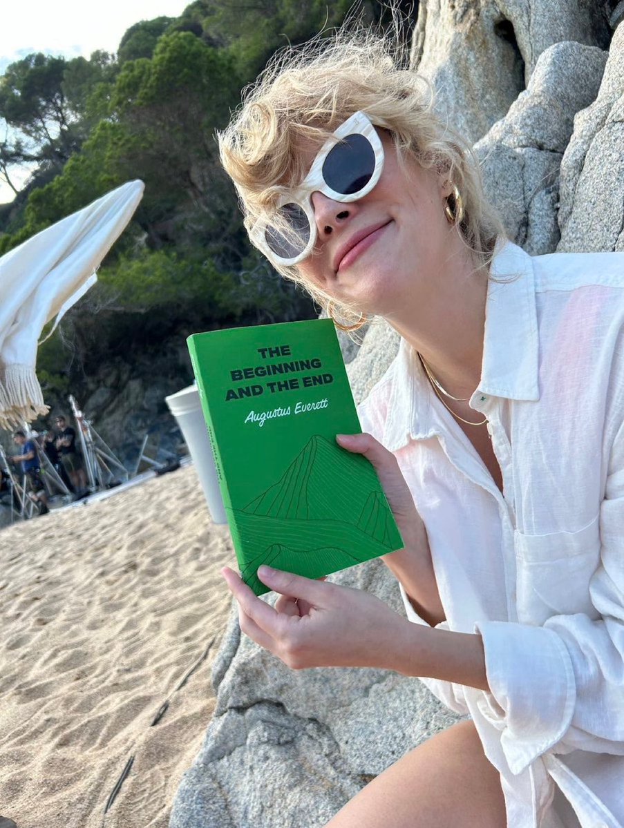 stylesgala's tweet image. emily henry took a picture of herself holding augustus everett’s book. there are so many layers to this.