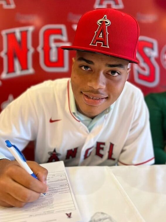 ThatAngelsGuy's tweet photo. Day 3- Joswa Lugo: in depth Angels prospect report

One of the highest upside position players in the Angels system. Signed out of the Dominican Republic, Lugo has quickly emerged as a legitimate middle of the order bat with real power potential.

Tools:
• Hit: improving approach, works counts, flashes feel for contact
• Power: plus raw power, already producing loud contact
• Speed: average runner, enough to move early in his career
• Defense: solid actions at SS, likely future move to 3B
• Arm: above-average, easily plays on the left side

Scouting grades (20–80):
Hit 50 | Power 60 | Speed 50 | Defense 50 | Arm 55 | Overall 55

Why he works:
Big frame, strength, and bat speed. Posted strong early pro results and consistently shows impact contact for his age. Power is the carrying tool and still growing as he learns to lift the ball.

MLB comp:
Rafael Devers "lite" — physical left side infielder with plus raw power, strong arm, and enough feel to hit. Likely moves off SS long-term but profiles as an everyday run producer at 3B if the hit tool continues to develop.

Projection:
Everyday corner infielder with real middle of the order upside.

ETA: 2028

Risk: high, typical for teenage hitters, but the ceiling is worth it

This is a bat you build around if it hits. One of the most exciting offensive upside plays in the system.

#Angels #Prospects #MiLB