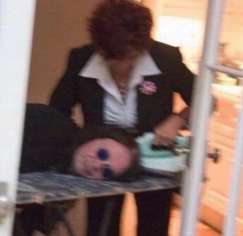 historyrock_'s tweet image. Sharon Osbourne straightening Ozzy’s hair with an iron