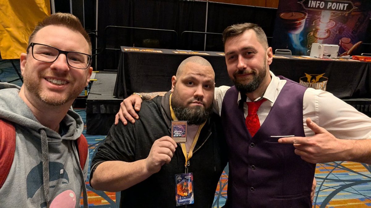 ATeague476's tweet photo. First DLC main event is tomorrow, thankfully I was able to enjoy the venue today and meet some great new people. Special thanks to @LorcanaVillain for signing a couple cards for me. That yata is going on the front page of my collection binder. https://t.co/JrXljtoq5s