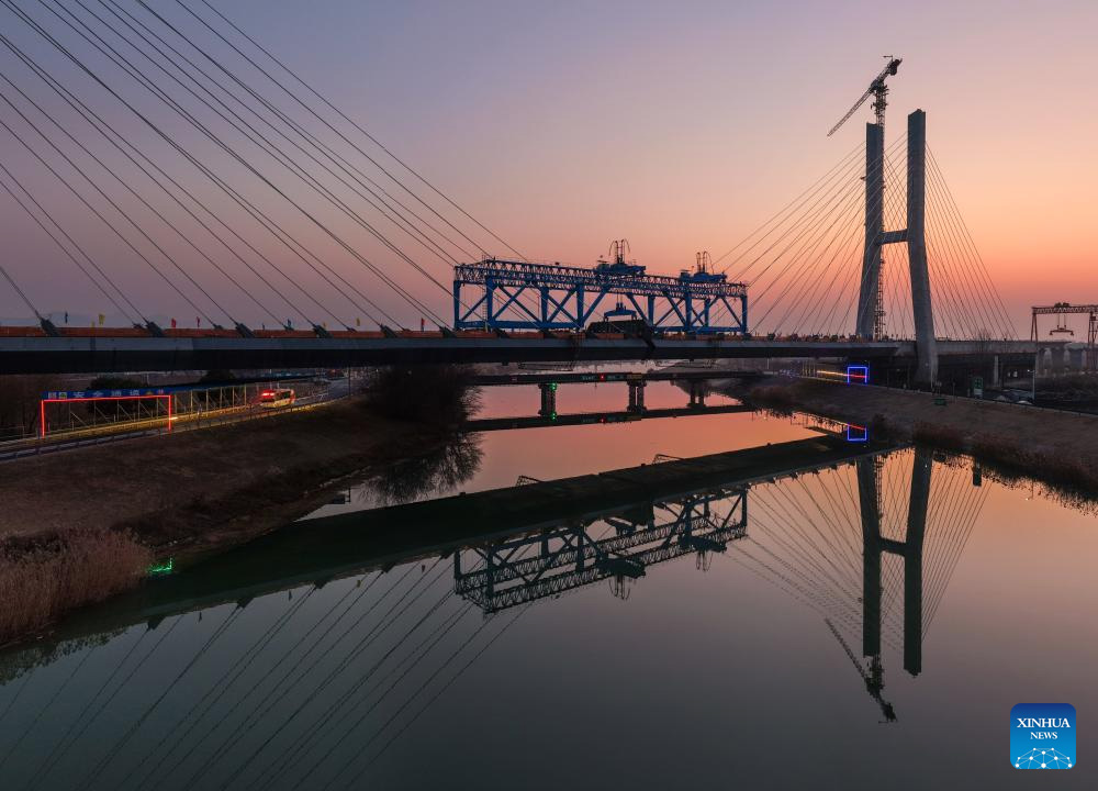 VoiceofPD's tweet image. Cable-stayed bridge across Chuhe River completes closure in Nanjing, China's Jiangsu

An aerial drone photo taken on Jan. 9, 2026 shows the construction site of the #cable-stayed #bridge across the Chuhe River in #Nanjing, east #China's #Jiangsu Province. As part of a high-speed