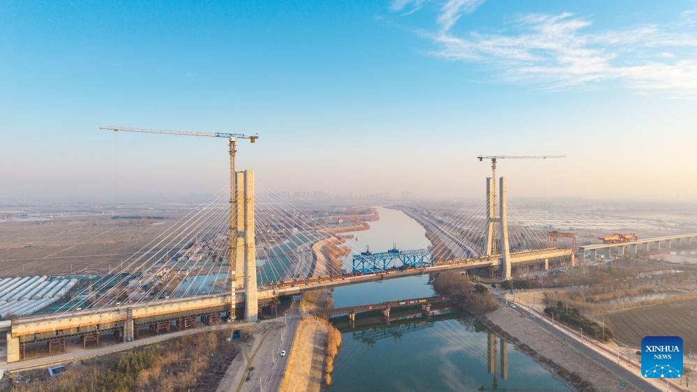 VoiceofPD's tweet image. Cable-stayed bridge across Chuhe River completes closure in Nanjing, China's Jiangsu

An aerial drone photo taken on Jan. 9, 2026 shows the construction site of the #cable-stayed #bridge across the Chuhe River in #Nanjing, east #China's #Jiangsu Province. As part of a high-speed