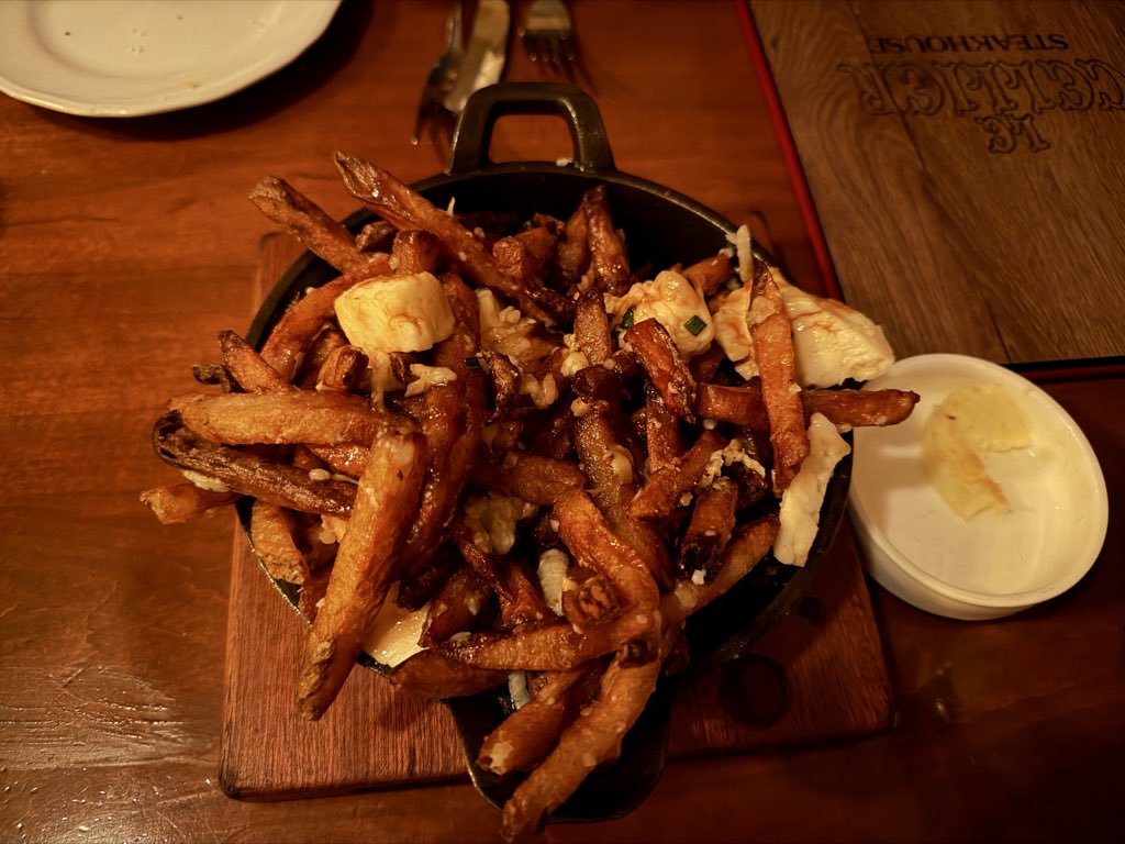 DisneyTripTips's tweet image. We hardly made a dent in the poutine appetizer!!! Le Cellier at Canada in EPCOT