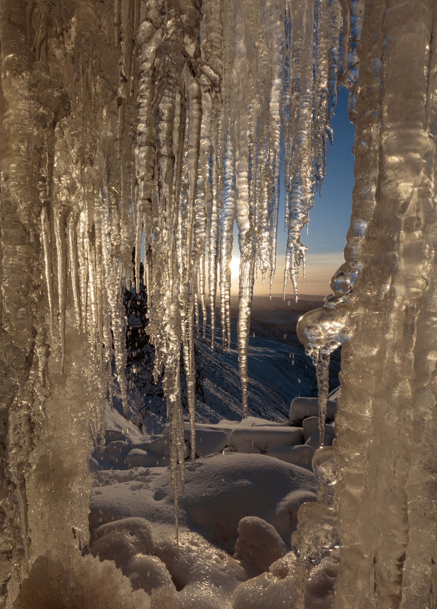 This afternoon I snuck in behind a frozen waterfall: Kinder Downfall in the Peak District