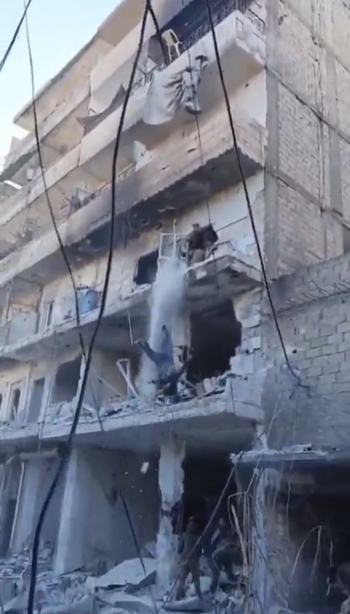 NoaMagid's tweet photo. These are Jolani’s terrorists - throwing Kurdish women off buildings in Aleppo. https://t.co/cKcTONBbfH