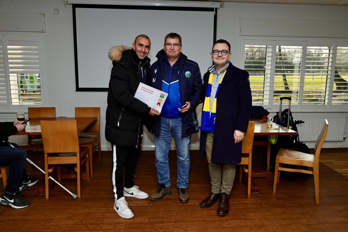 AscotUnitedFC's tweet photo. A special pre-match at The Racecourse today as we welcomed a couple of guests and took time to recognise the people who make our club what it is!

We were delighted to be joined by Pitching In representative Orlando Bell, alongside our local MP Jack Frankin, ahead of kick-off.

Pitching In continue to provide vital support for Step 3 and Step 4 clubs, and we’re incredibly grateful for the funding already received to help launch a second unified football team this year. We have also submitted a bid for further practical support for our junior coaches and are still awaiting the outcome.

During the visit, we were proud to celebrate four outstanding volunteers whose commitment goes above and beyond every week!

🏅Dean Papali (Under 14 Royals)
Dean has provided invaluable support to both his players and parents through extreme adversity over the last two months. I would like to thank him for this invaluable contribution.

🏅 Ryan Benzie (Under 14 Royals)
A long-serving coach and manager whose dedication and support for his teams and families over many years has been invaluable.

🏅 Clare McDonagh (U18 Diamonds)
From U11s to U18s, Clare has been a dedicated coach and manager for a number of years, playing a huge role in the development of girls’ and women’s football at Ascot United.

🏅 Neal Jeffs
Matchday programme editor since 2014, originally just for one season. Neal has now produced over 300 programmes and also provides match reports for both our men’s and women’s teams.

A huge thank you to Orlando and Jack for visiting, and to every volunteer who continues to give their time, energy and passion to our club. 

This is community football at its best! 👏⚽

#WeAreAscot