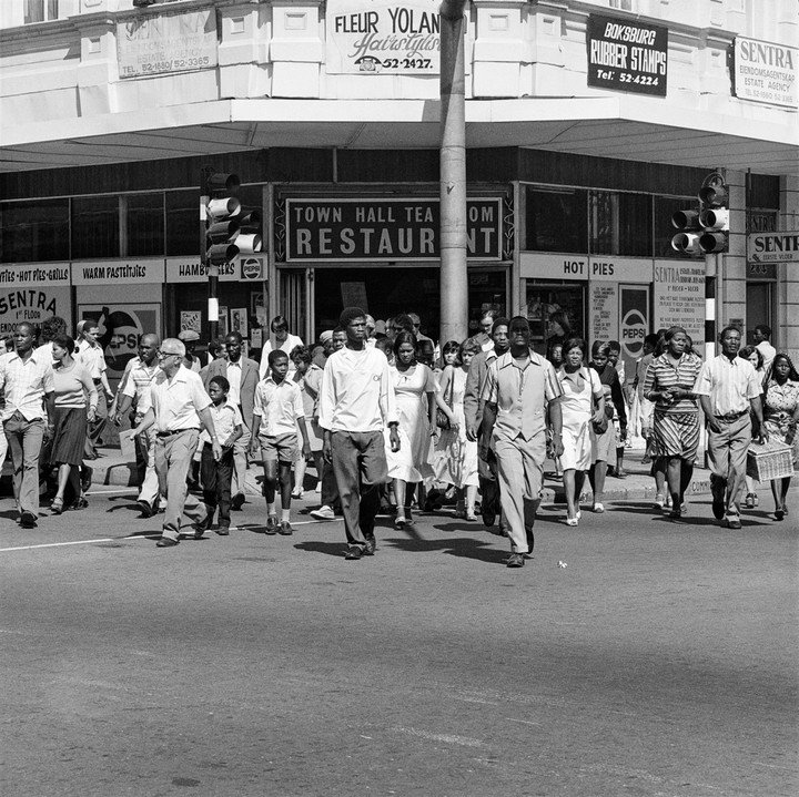 HistorySAZAR's tweet image. Saturday morning at the corner of Commissioner and Trichardts Streets, 1979-1980. Photo: David Goldblatt