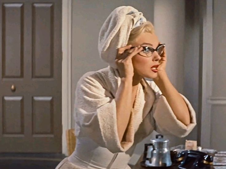 Marilyn Monroe as her character Pola Debevoise after taking a shower in How to Marry a Millionaire (1953).