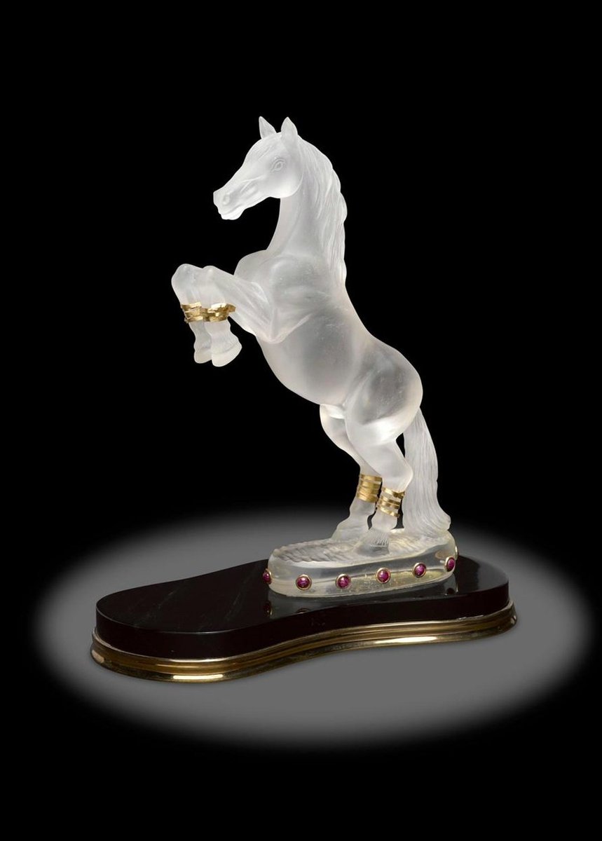 Fine Rock Crystal Carving of a Horse with Ruby and Obsidian Base by artist Luis Alberto Quispe Aparicio.