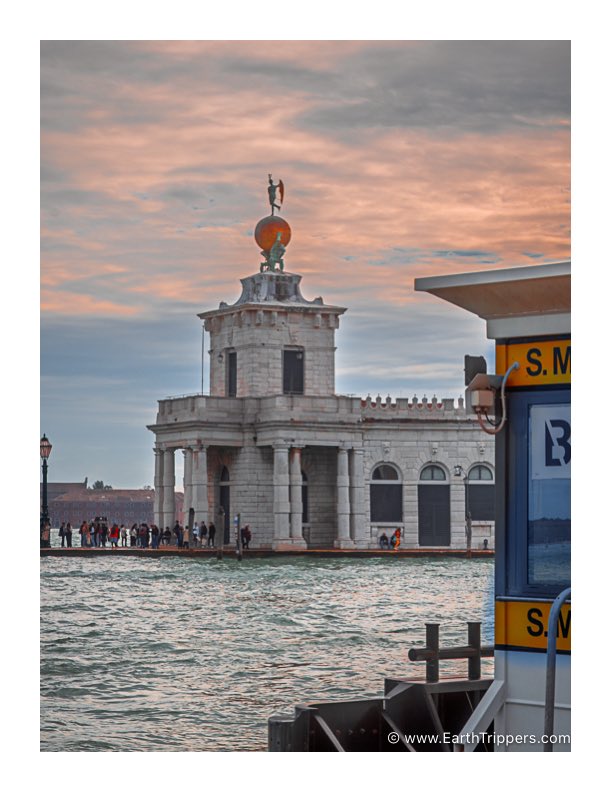 One of my favorite buildings in Venice. The old customs house at the mouth of the Grand Canal. 

Want to sell something in Venice? Stop here first to pay your duties. 

Now a big art gallery. On top, the weathervane Fortuna wishes you favourable winds for your voyage.