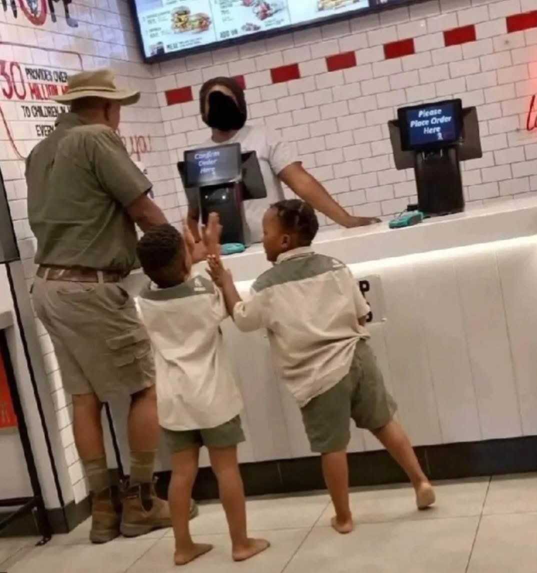 Me and my kids after buying a Land Cruiser and 1 goat