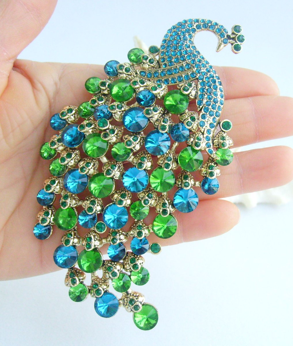 Introducing our gorgeous Peacock Brooch, adorned with rhinestone crystals. Perfect for your outfit, jacket, scarf, or even a hat. Thanks to the hook of the back that also can be use as a pendant. etsy.com/listing/432299… #PeacockBrooch #AnimalBrooch #CostumeJewelry #PeafowlBrooch