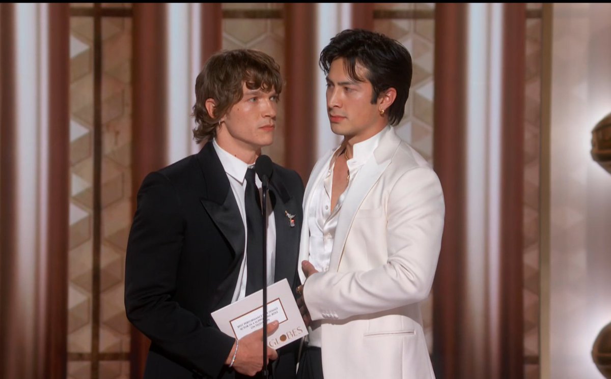 Connor Storrie and Hudson Williams presenting at the #GoldenGlobes.