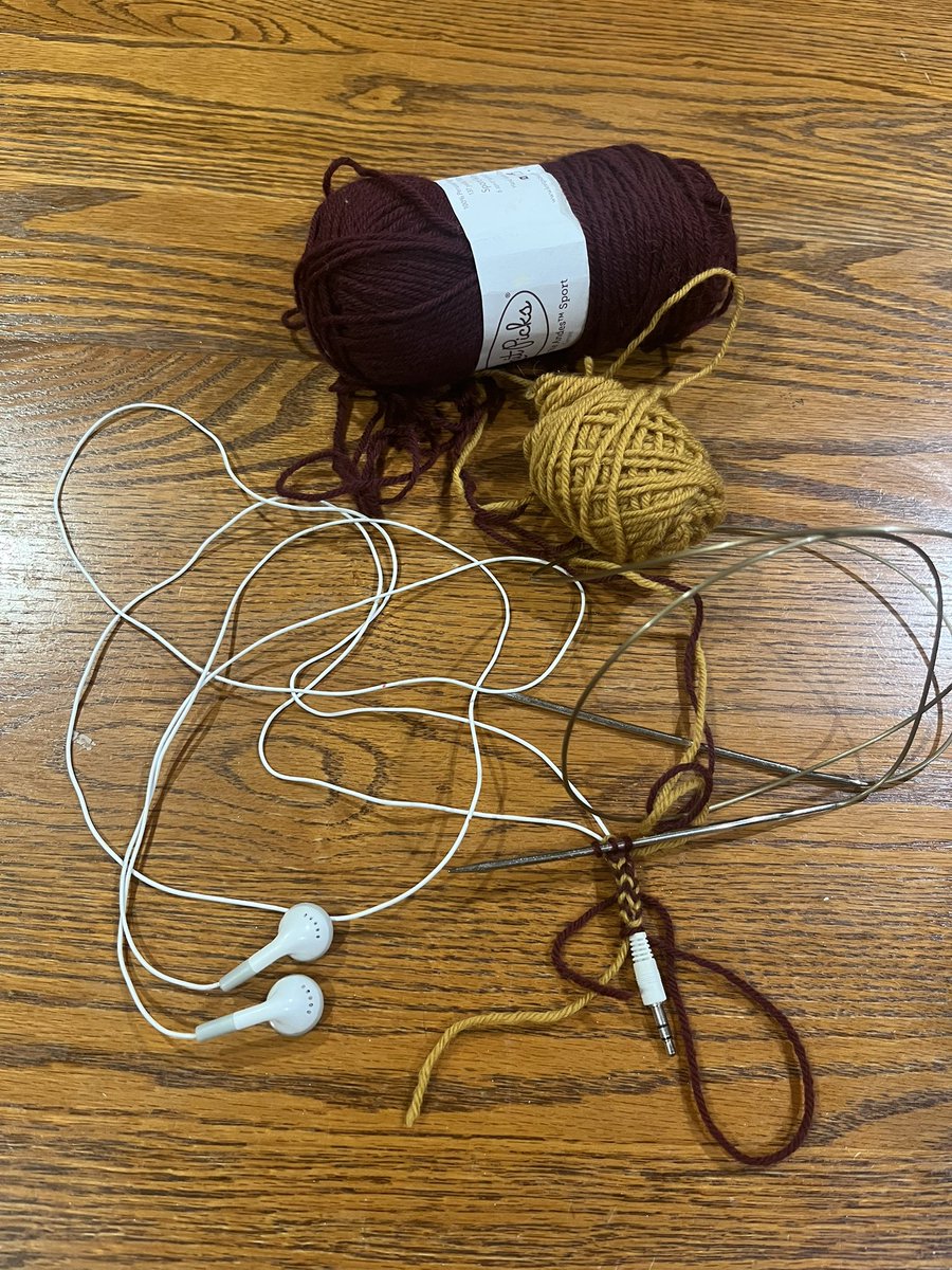 Daughter accidentally separated the iPod earbud wires all the way down to the plug, so I’m going old school and knitting her a cover like I used to do with mine! She chose school colors, which I fortunately happened to have in my yarn stash.