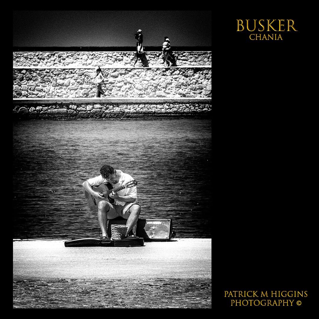 Busker. @patrickmhiggins #busker #streetmusician #bnwportrait #streetlife #guitarist