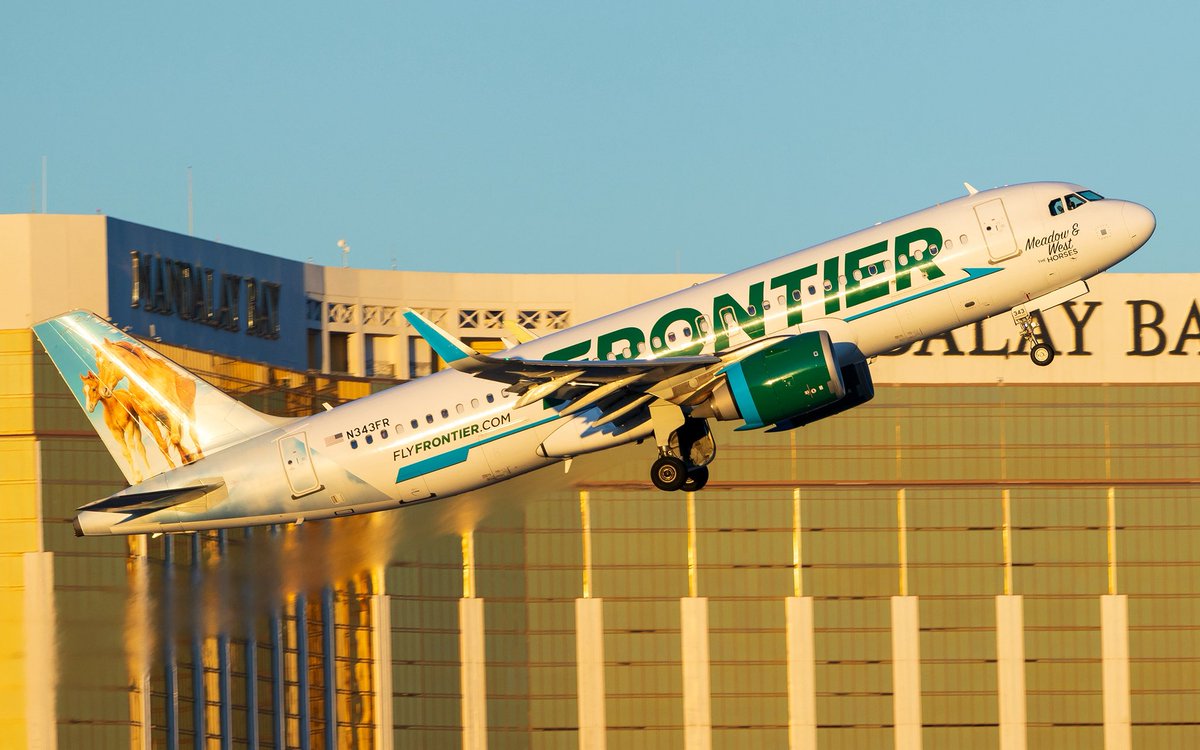 A Frontier A320neo climbing out of runway 1R at LAS in some amazing early morning light.