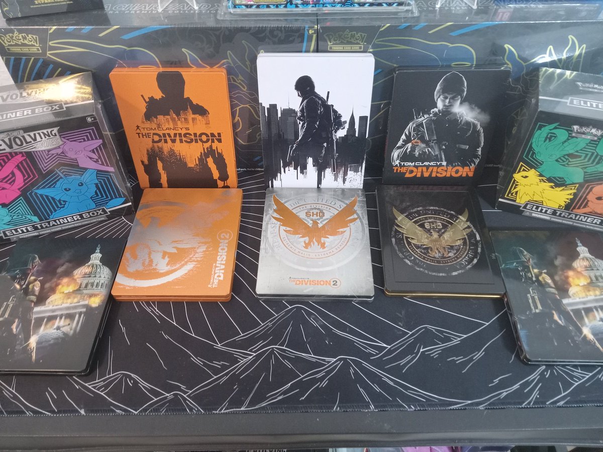TSwandol's tweet photo. Man pulling all my @TheDivisionGame Stuff out is bringing back some GREAT MEMORIES!! The 6ft tall 3D Division Agent Poster along with the other posters will get framed soon. Also, I love how many Steelbooks they put out, some were only for certain regions so they were expensive! https://t.co/dfXqmVqt6c