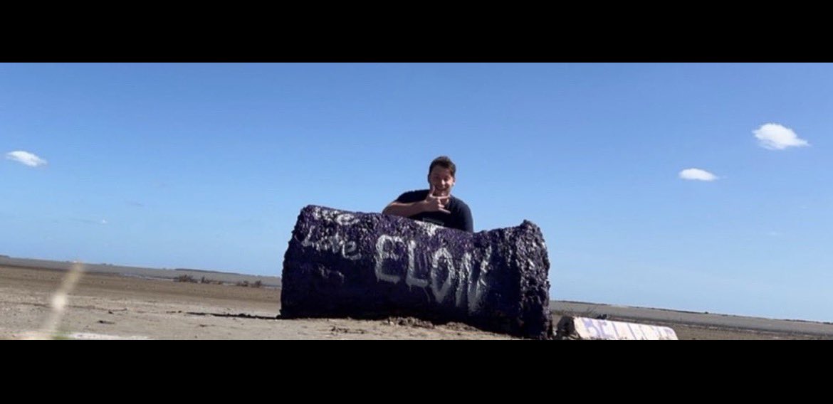 AiDayGuy's tweet photo. The purple 💜 “We Love Elon” boulder I painted, during my 352 days camping at @SpaceX to meet @elonmusk, is being added to a SpaceX museum as a marker of that early, rough-and-tumble phase before Starbase became a city! Purple is the branding of the holiday I founded for @elonmusk. I’m honored 🥰 https://t.co/wP0x2o6RKq