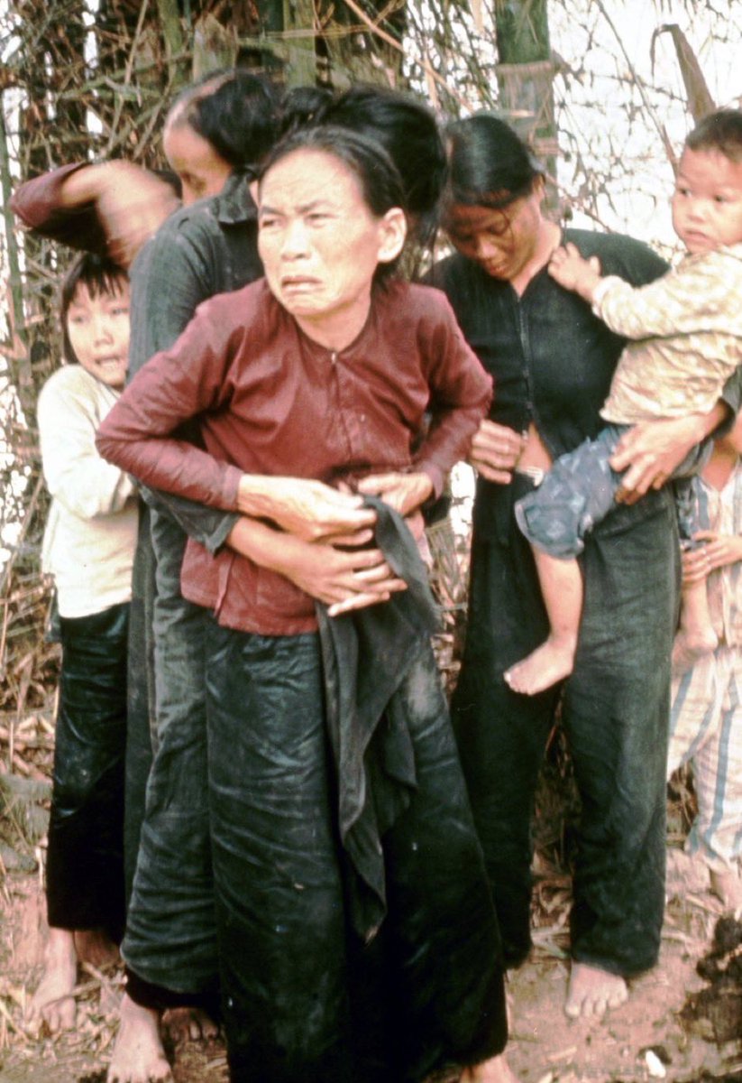 MorbidKnowledge's tweet image. A Vietnamese teenager buttons up her Mothers blouse after she was se*ually assaulted by American Gl's. They were gunned down moments after this photo was taken. My Lai Ma*sacre, Vietnam. 16 March 1968.